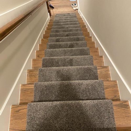 Hardwood on Stairs was refinished and carpet runner added